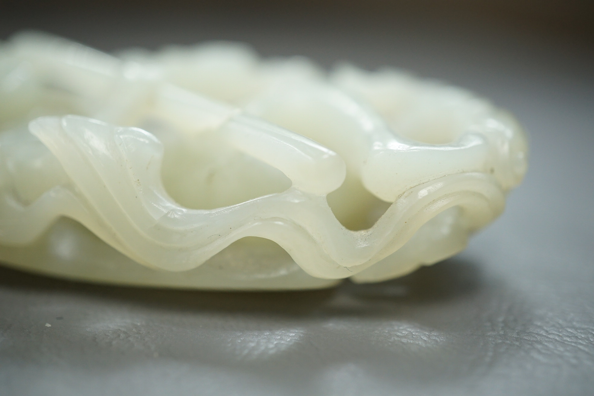 A Chinese pale celadon jade carving of Sun Wukong, the Monkey King, 18th/19th century